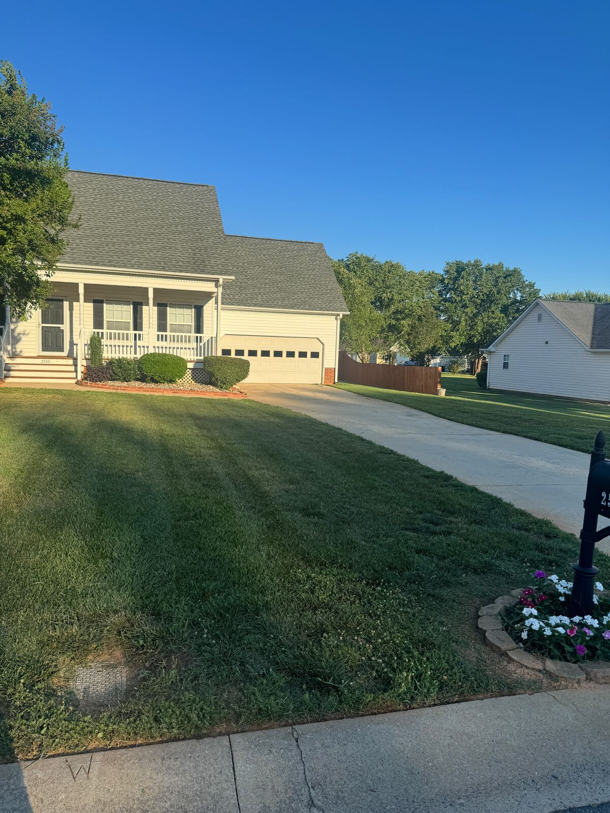 Striped front lawn and clean walkway